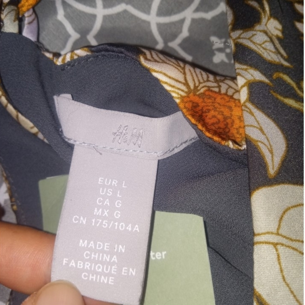 H&M Floral Blouse with Orange and Gray Accents